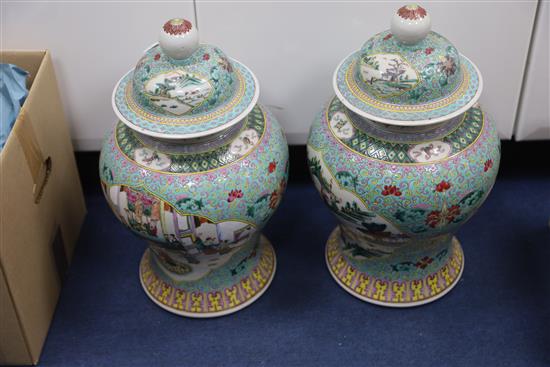 A pair of Chinese famille rose jars and covers, late 19th century, H. 45.5cm